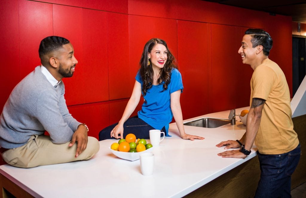 Three People Near Table Talking
